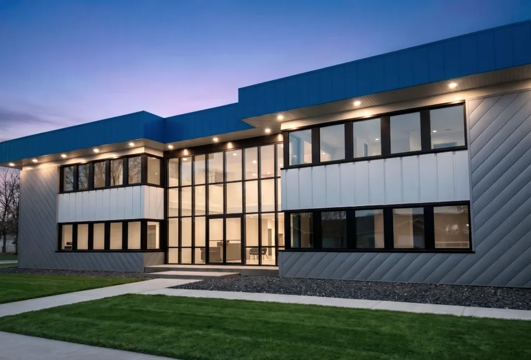 Modern Integritas office building exterior at dusk